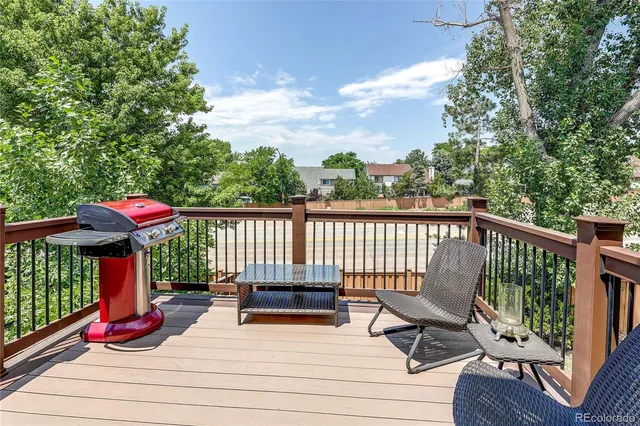 a view of a chairs and table on the deck