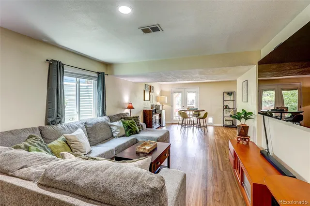 a living room with furniture and a table