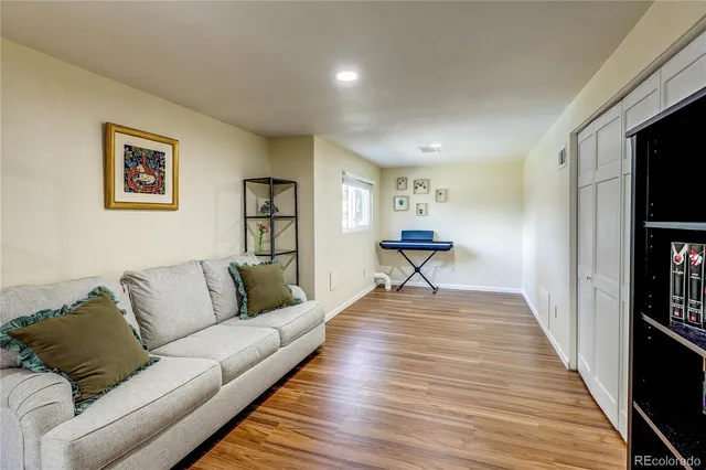 a living room with furniture and a rug