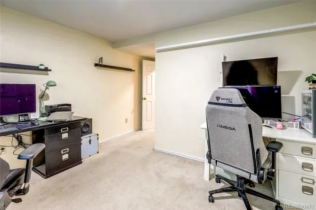 a view of a workspace with furniture