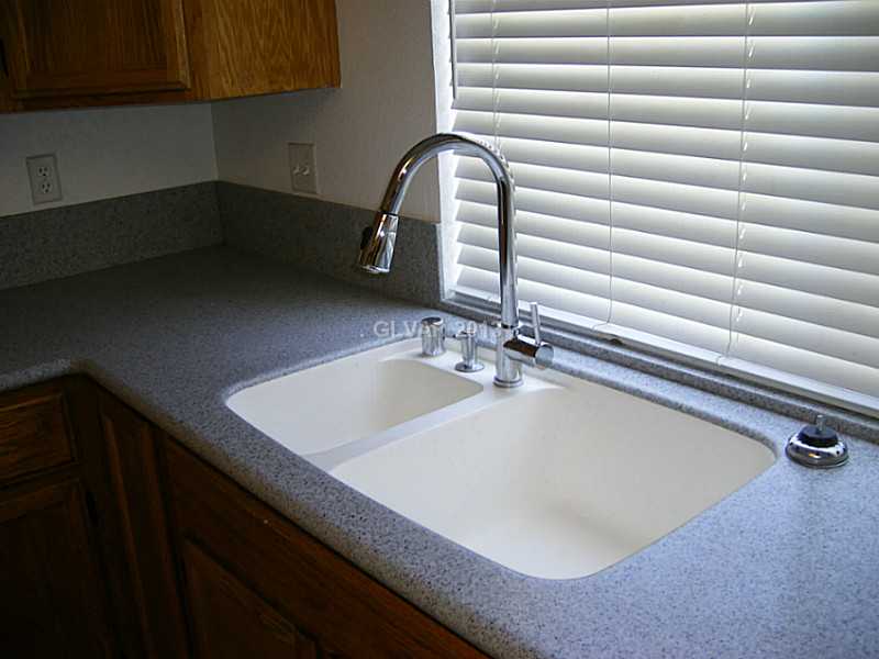 550 Heswall Court Henderson, NV 89014 - Photo 9 of 35 Kitchen. Solid surface, including sink