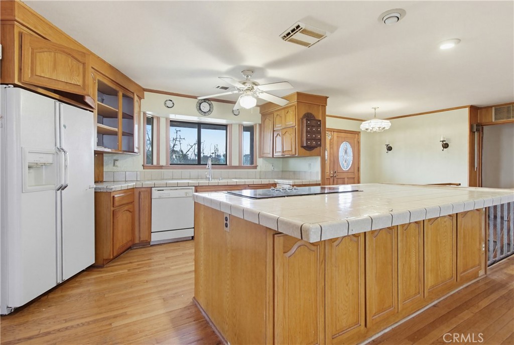 11905 Sierra Rojo Road Valley Center, CA 92082 - Photo 12 of 65 a kitchen with stainless steel appliances granite countertop a sink and cabinets