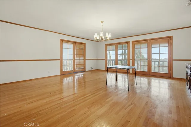 a bedroom with a large bed and a large window