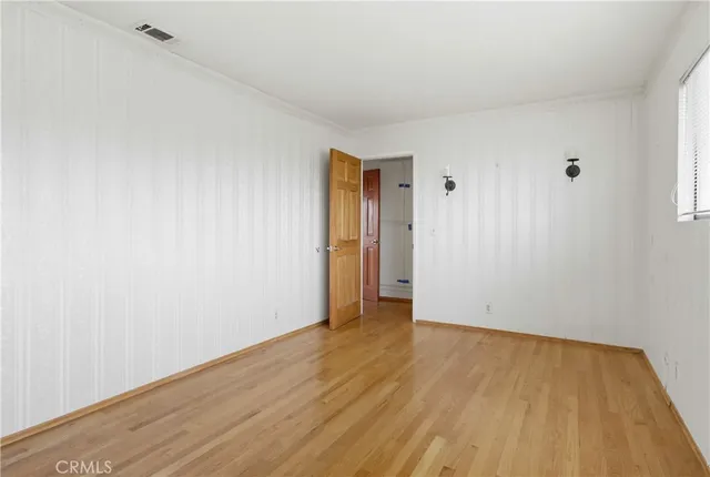 a large white kitchen with sink and window