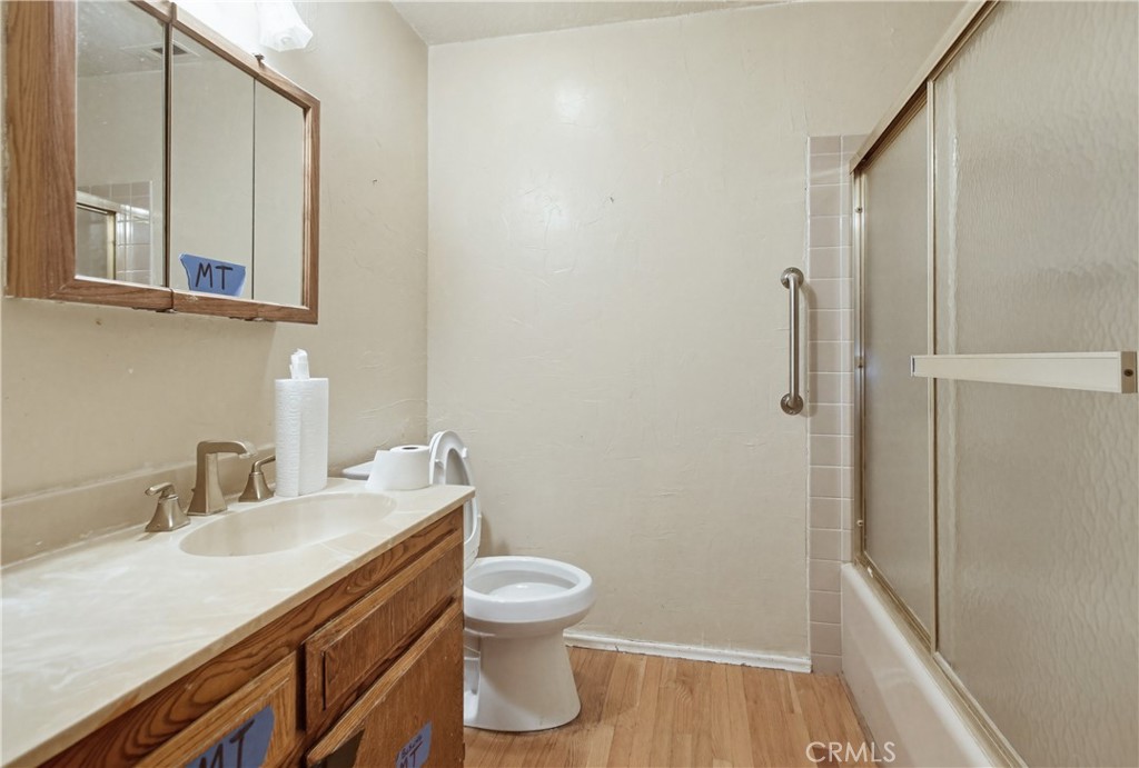 11905 Sierra Rojo Road Valley Center, CA 92082 - Photo 29 of 65 a bathroom with a granite countertop sink toilet and shower