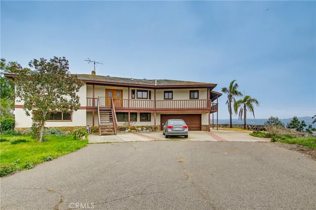 a view of house with outdoor space and porch