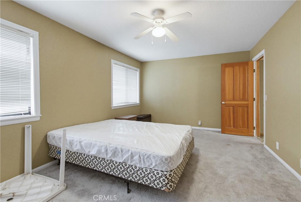 11905 Sierra Rojo Road Valley Center, CA 92082 - Photo 36 of 65 a bedroom with a bed and a window