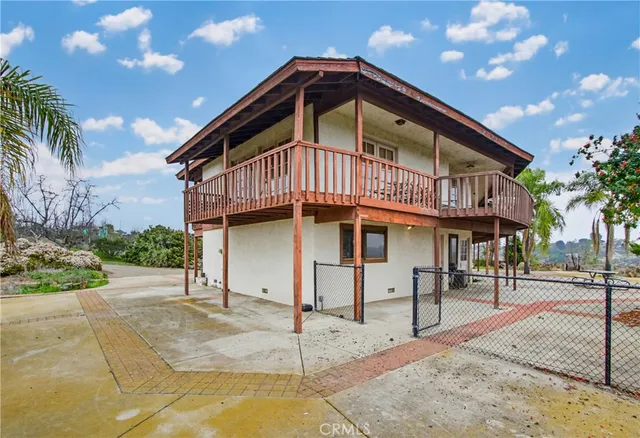 a view of a balcony with wooden floor