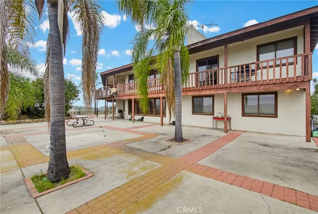 a view of a balcony with wooden floor