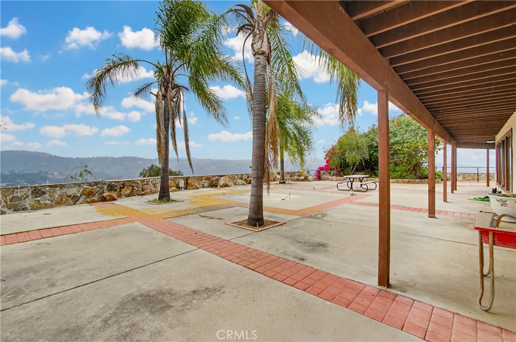 11905 Sierra Rojo Road Valley Center, CA 92082 - Photo 44 of 65 a view of a swimming pool with a patio