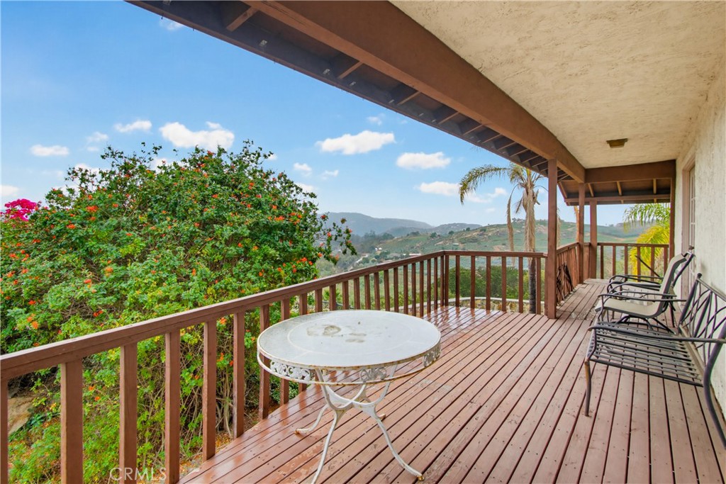 11905 Sierra Rojo Road Valley Center, CA 92082 - Photo 47 of 65 a view of a balcony with wooden floor