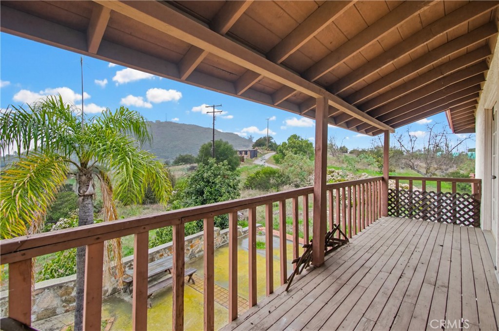 11905 Sierra Rojo Road Valley Center, CA 92082 - Photo 48 of 65 a view of a balcony with wooden floor