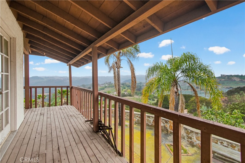11905 Sierra Rojo Road Valley Center, CA 92082 - Photo 50 of 65 a view of a balcony with wooden floor