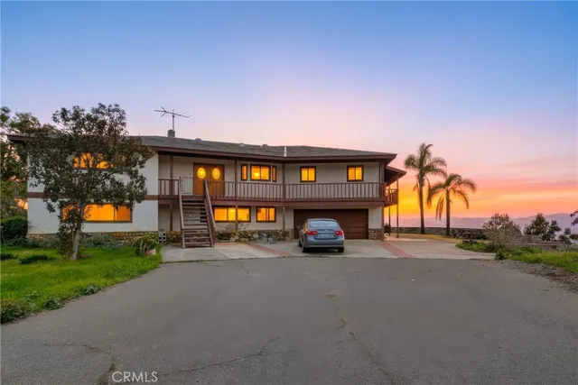 a view of swimming pool with an outdoor seating and a yard