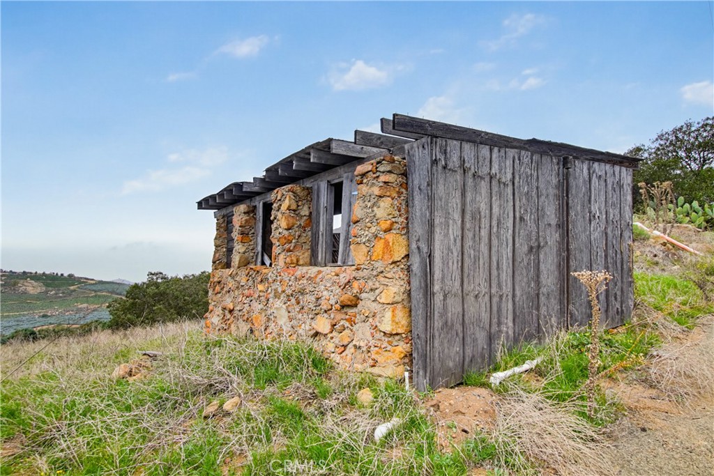11905 Sierra Rojo Road Valley Center, CA 92082 - Photo 61 of 65 a front view of a house with garden