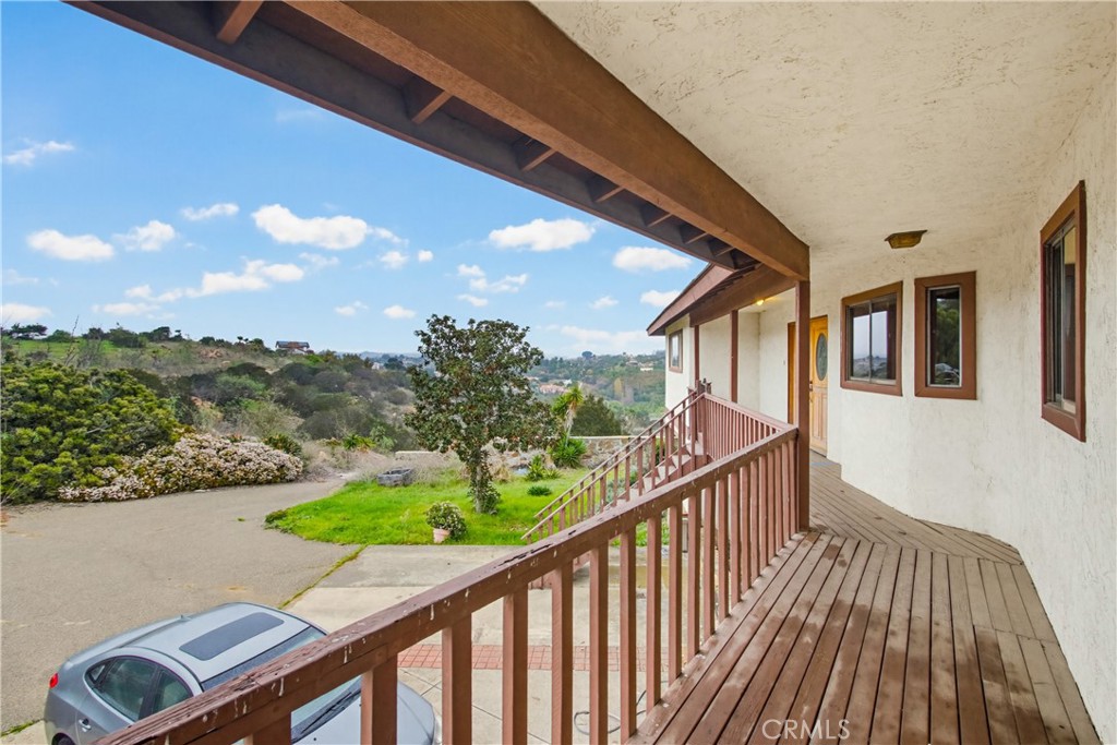 11905 Sierra Rojo Road Valley Center, CA 92082 - Photo 7 of 65 a view of balcony with wooden floor and fence