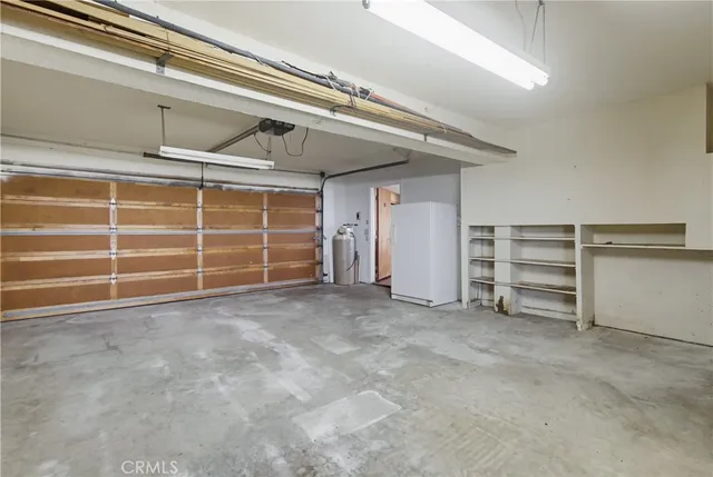a view of a livingroom with furniture and a window