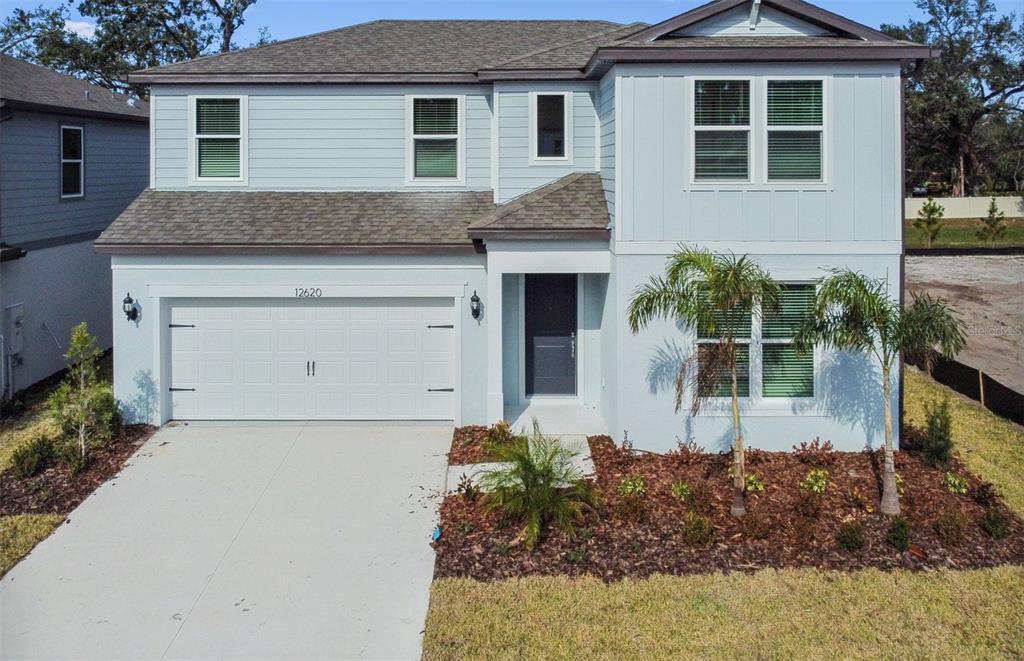 12620 Glenn Crk Drive Riverview, FL 33569 - Photo 1 of 1 a front view of a house with a garden