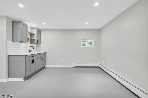 a view of kitchen with center island and windows