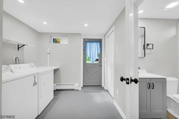 a view of a hallway with white doors