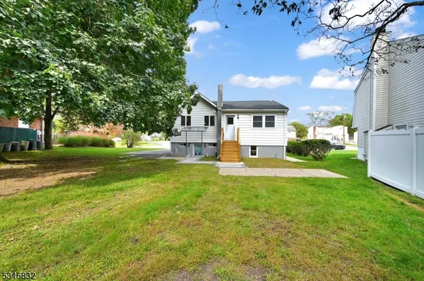 a view of house with outdoor space and garden