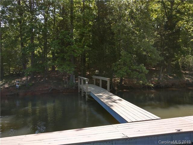 4167 River Oaks Road Clover, SC 29710 - Photo 2 of 5 a wooden deck with lake view