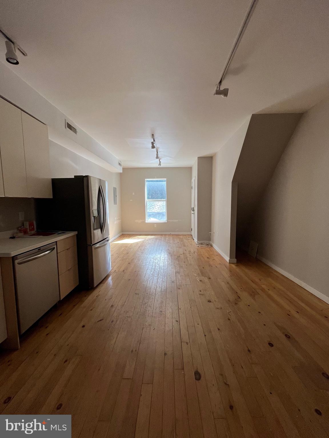 1208 North 4th Street, Unit 1 Philadelphia, PA 19122 - Photo 2 of 10 a view of a kitchen with wooden floor and electronic appliances