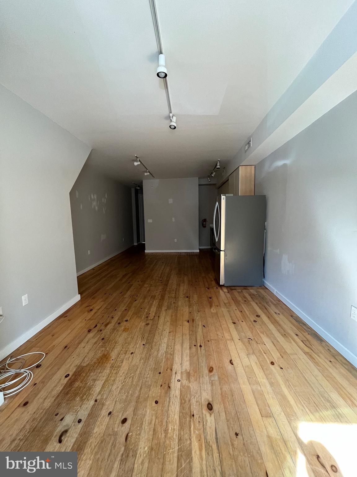 1208 North 4th Street, Unit 1 Philadelphia, PA 19122 - Photo 3 of 10 a view of empty room with wooden floor