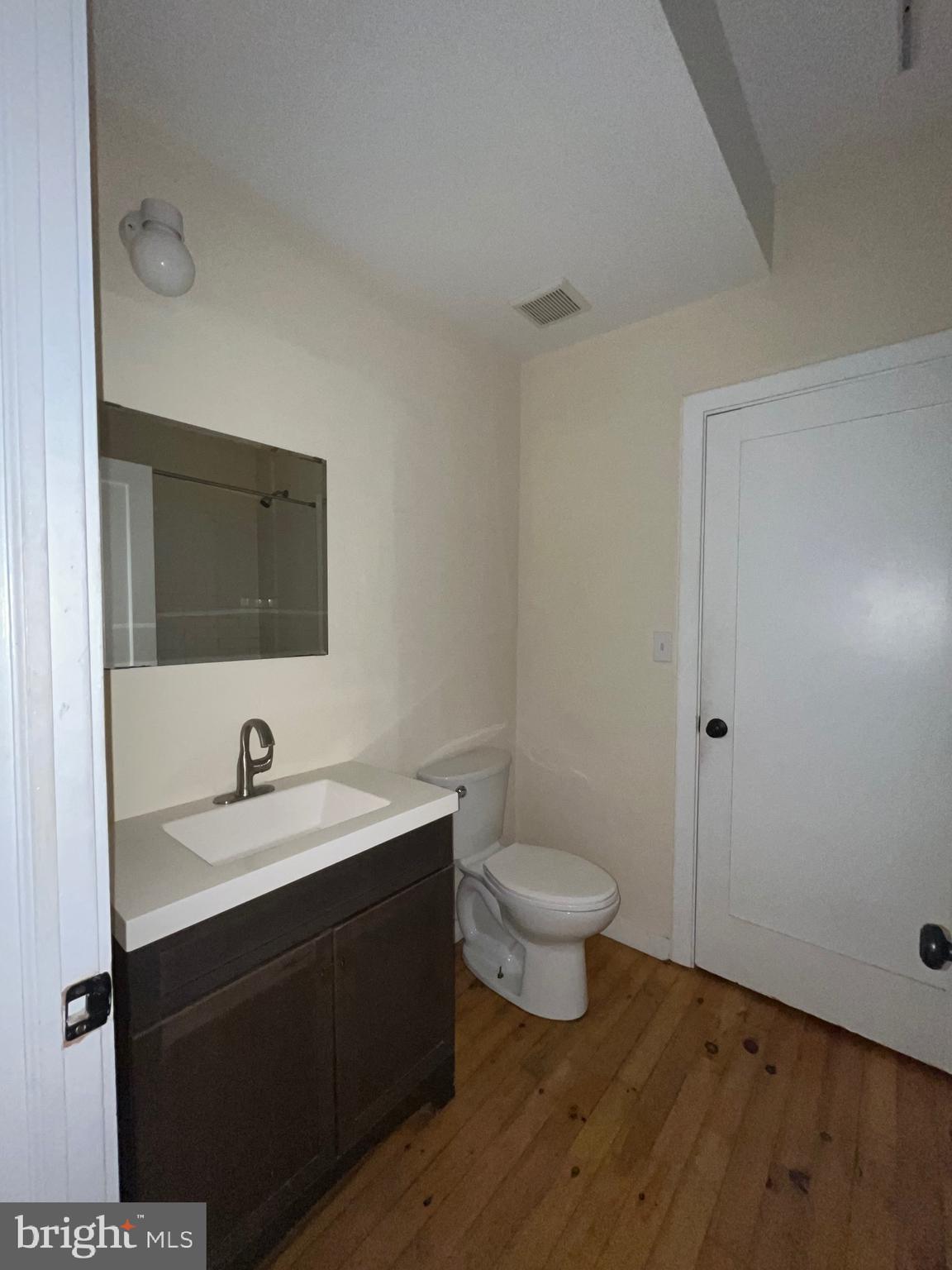 1208 North 4th Street, Unit 1 Philadelphia, PA 19122 - Photo 8 of 10 a bathroom with a sink and a mirror