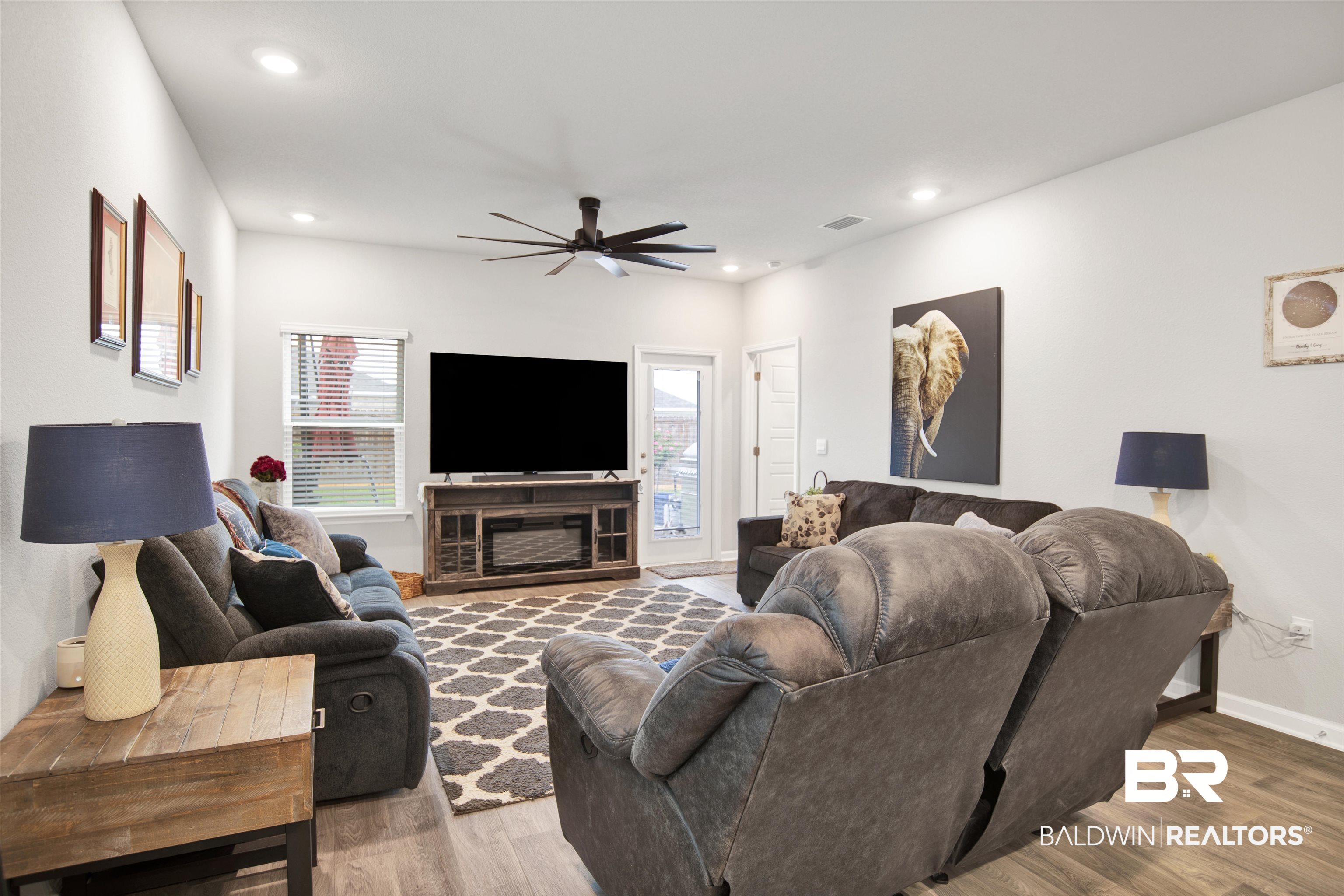 12813 Patriot Way Daphne, AL 36527 - Photo 5 of 23 Spacious living area featuring wood-finish flooring, recessed lighting, and a contemporary ceiling fan
