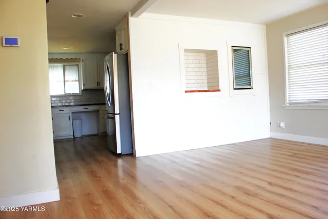 a view of a kitchen cabinets and wooden floor