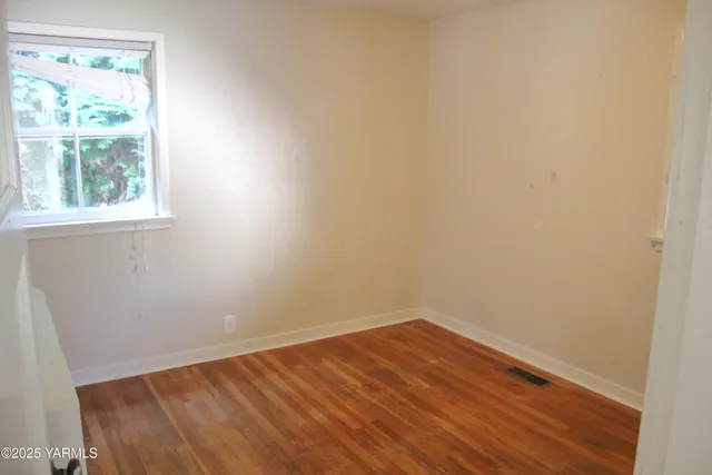 a view of a room that has a window in it