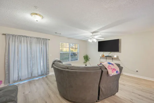 a room with furniture and flat screen tv