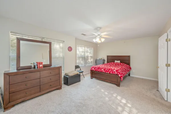 a bedroom with a bed and a dresser