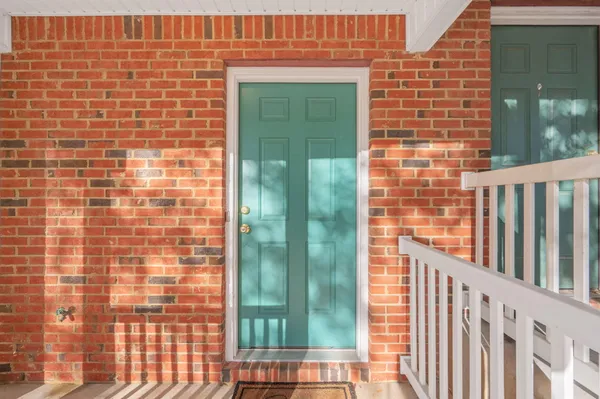 a view of a brick wall from a balcony