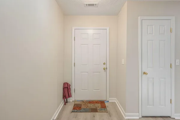 a view of room with window and hardwood