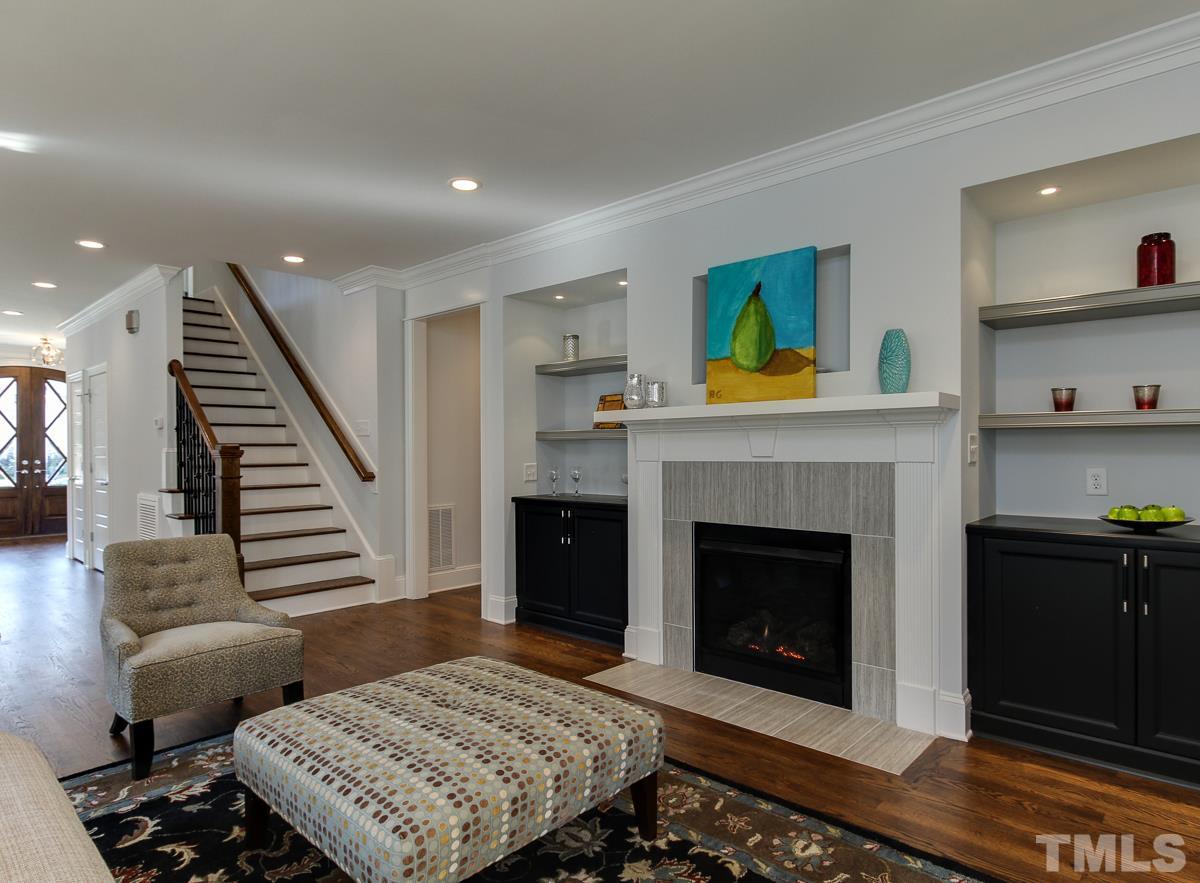 8800 Breeland Way Raleigh, NC 27613 - Photo 13 of 24 a living room with furniture and a fireplace