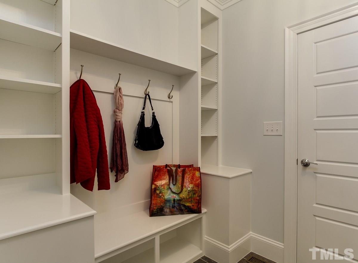 8800 Breeland Way Raleigh, NC 27613 - Photo 14 of 24 a view of walk in closet with clothes and shoes
