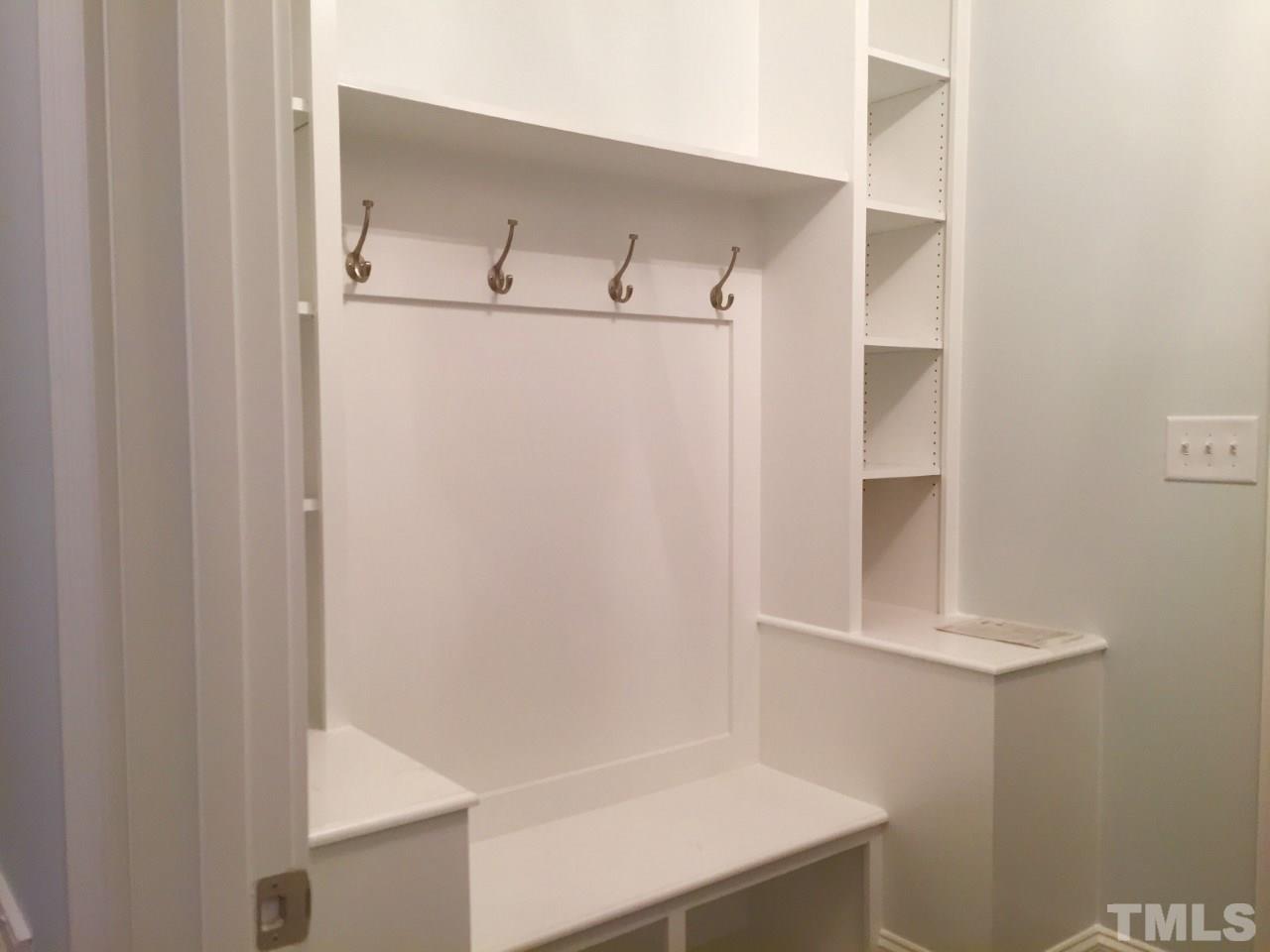 8800 Breeland Way Raleigh, NC 27613 - Photo 20 of 24 a view of walk in closet with empty racks
