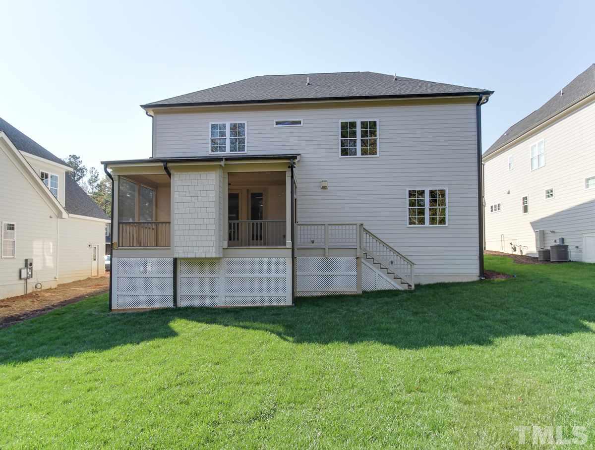 8800 Breeland Way Raleigh, NC 27613 - Photo 23 of 24 a front view of a house with a yard