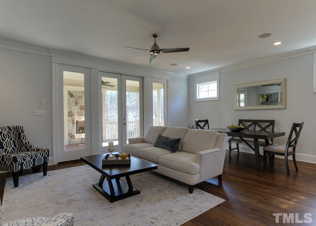 8800 Breeland Way Raleigh, NC 27613 - Photo 8 of 24 a living room with furniture and wooden floor