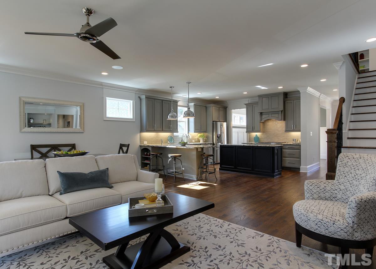 8800 Breeland Way Raleigh, NC 27613 - Photo 9 of 24 a living room with furniture kitchen view and a table