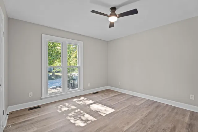 a living room with a fireplace and a table