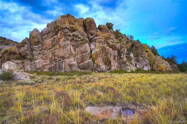 a view of a field with an ocean view