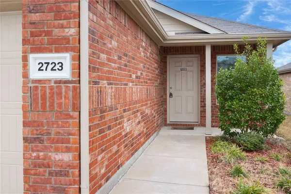 a view of front door of house and stairs