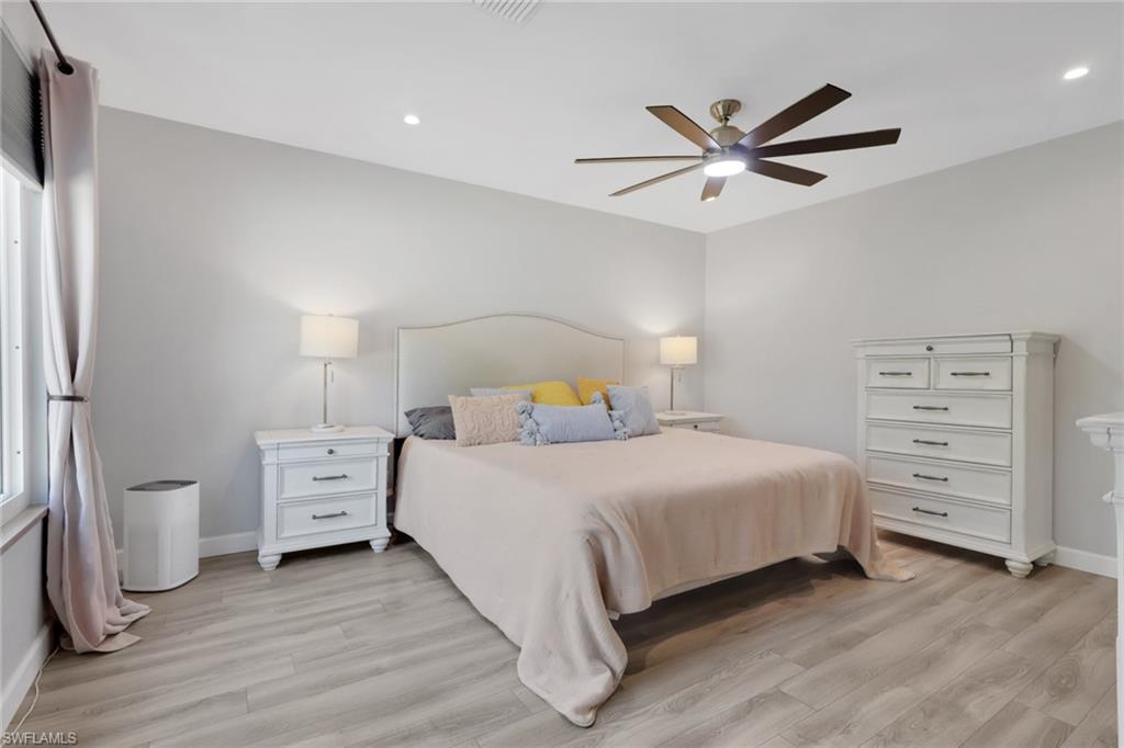 5092 Boxwood Way Naples, FL 34116 - Photo 11 of 48 Large master suite with tons of natural lighting and a perfect view of the pool/patio area - your own outdoor oasis