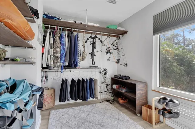a bathroom with a bathtub shower sink vanity and toilet