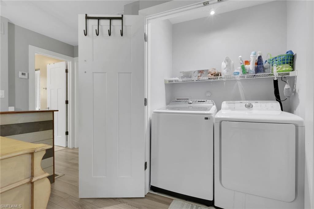 5092 Boxwood Way Naples, FL 34116 - Photo 20 of 48 a utility room with dryer and washer