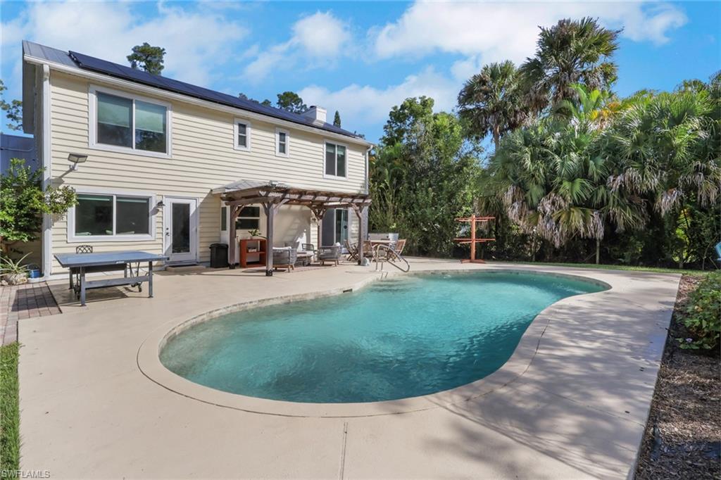 5092 Boxwood Way Naples, FL 34116 - Photo 22 of 48 Beautiful saltwater sports pool with a huge patio area with tons of space for seating, relaxing, entertaining, and so much more