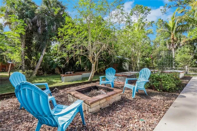 a view of a house with a yard porch and sitting area